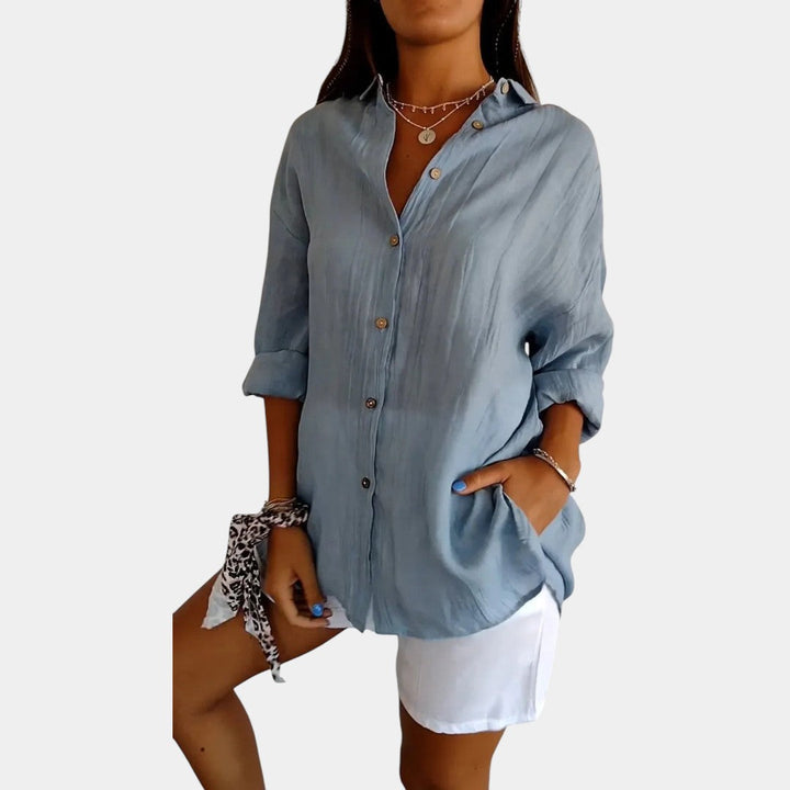 Klassieke damesblouse met lange mouwen in effen kleur, veelzijdig voor casual of zakelijke mode.