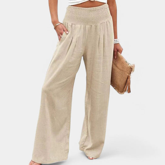 "Luchtige linnen broek met hoge taille en flared pijpen, ideaal voor zomerse dagen, in een elegante beige tint."