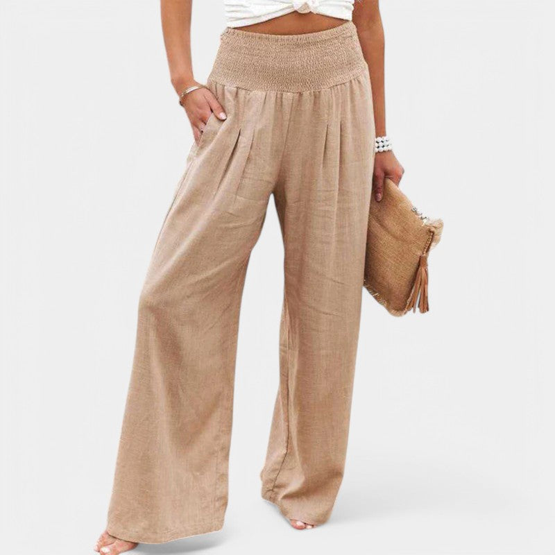 "Luchtige linnen broek met hoge taille en flared pijpen, ideaal voor zomerse dagen, in een elegante beige tint."