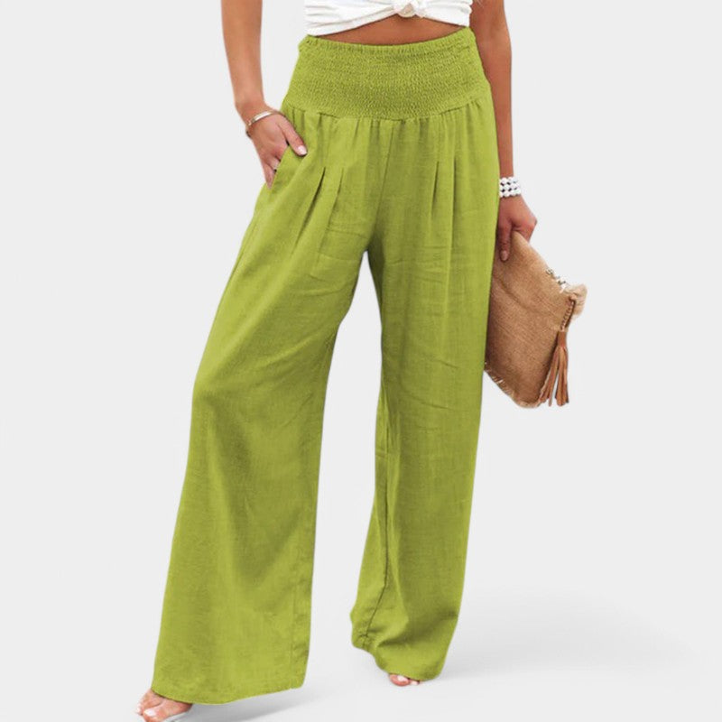 "Luchtige linnen broek met hoge taille en flared pijpen, ideaal voor zomerse dagen, in een elegante beige tint."