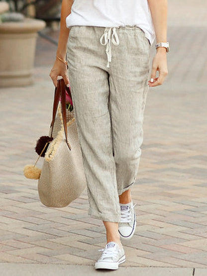 "Luchtige linnen zomerbroek voor dames, beige, met verstelbaar trekkoord voor stijlvol en comfortabel zomerse look."