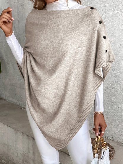 "Luxe dames poncho met elegante knoopsluiting, zacht ademend materiaal, perfect voor casual en formele outfits."