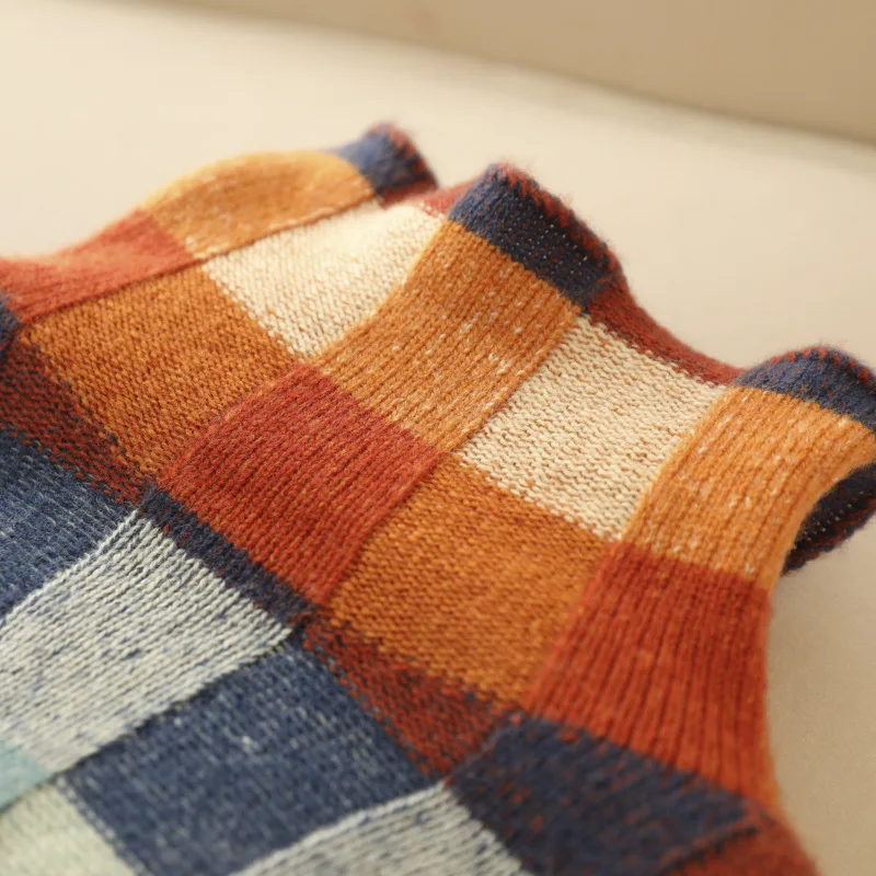 Luxe kasjmier coltrui dames met kleurrijke melange accenten; ultrazachte stof en ruime col voor ultiem comfort.