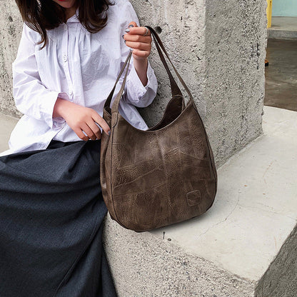 "Luxe leren schoudertas voor vrouwen, elegant design, duurzaam echt leer, ruim met georganiseerde vakken."