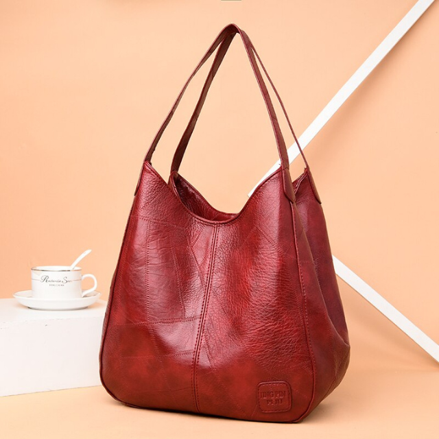 "Luxe leren schoudertas voor vrouwen, elegant design, duurzaam echt leer, ruim met georganiseerde vakken."