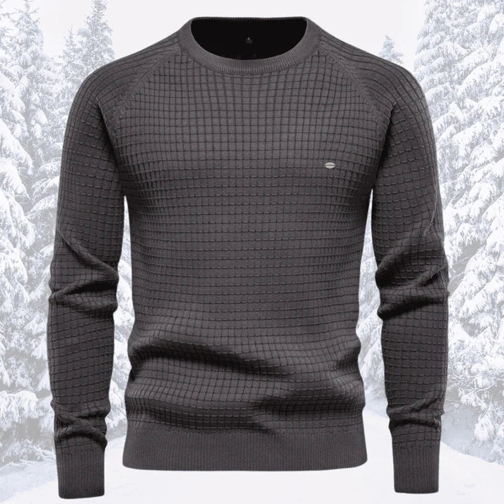 Detail van de kraag en manchetten van deze comfortabele, gebreide heren trui, toont kwaliteit.