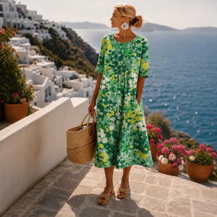 Comfortabele casual roze gebloemde midi jurk met losse pasvorm, perfecte dames zomerjurk voor strand of dagje uit.