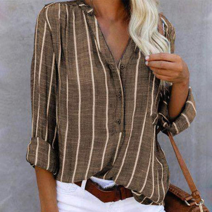 Dames gestreepte blouse met V-hals en lange mouwen, ideaal voor een casual of zakelijke look.