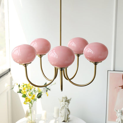 "Moderne kroonluchter met gouden afwerking en roze glazen kappen, geschikt voor LED verlichting in eigentijds interieur."