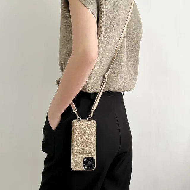 Praktisch roze lederen telefoonhoesje met schouderband en ruimte voor pasjes, handsfree accessoire.