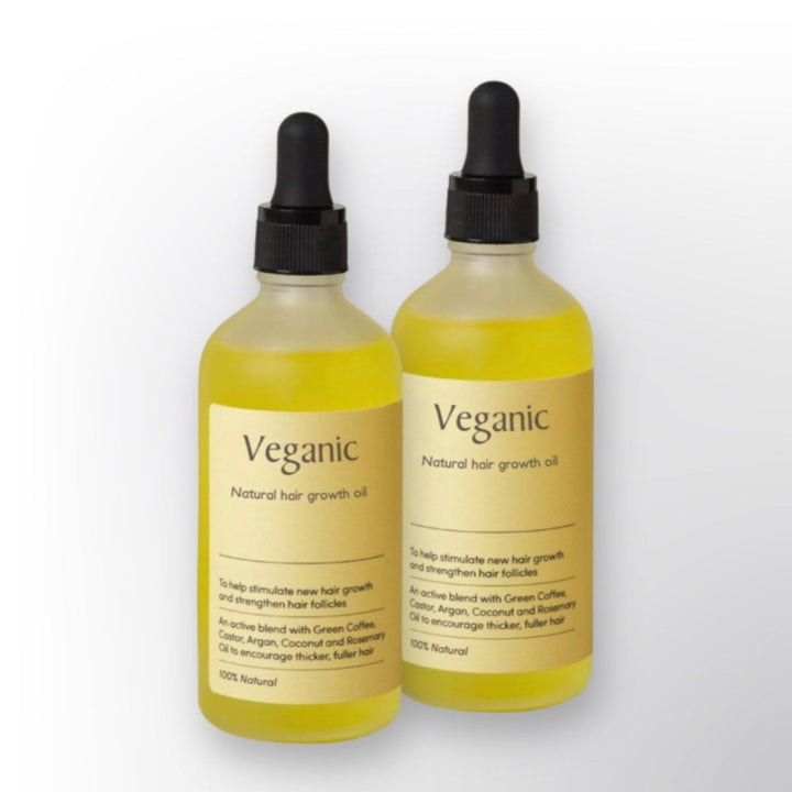Close-up van Natuurlijk Haargroei Serum met pipet. Bevordert gezonde hoofdhuid & sterker, voller haar.