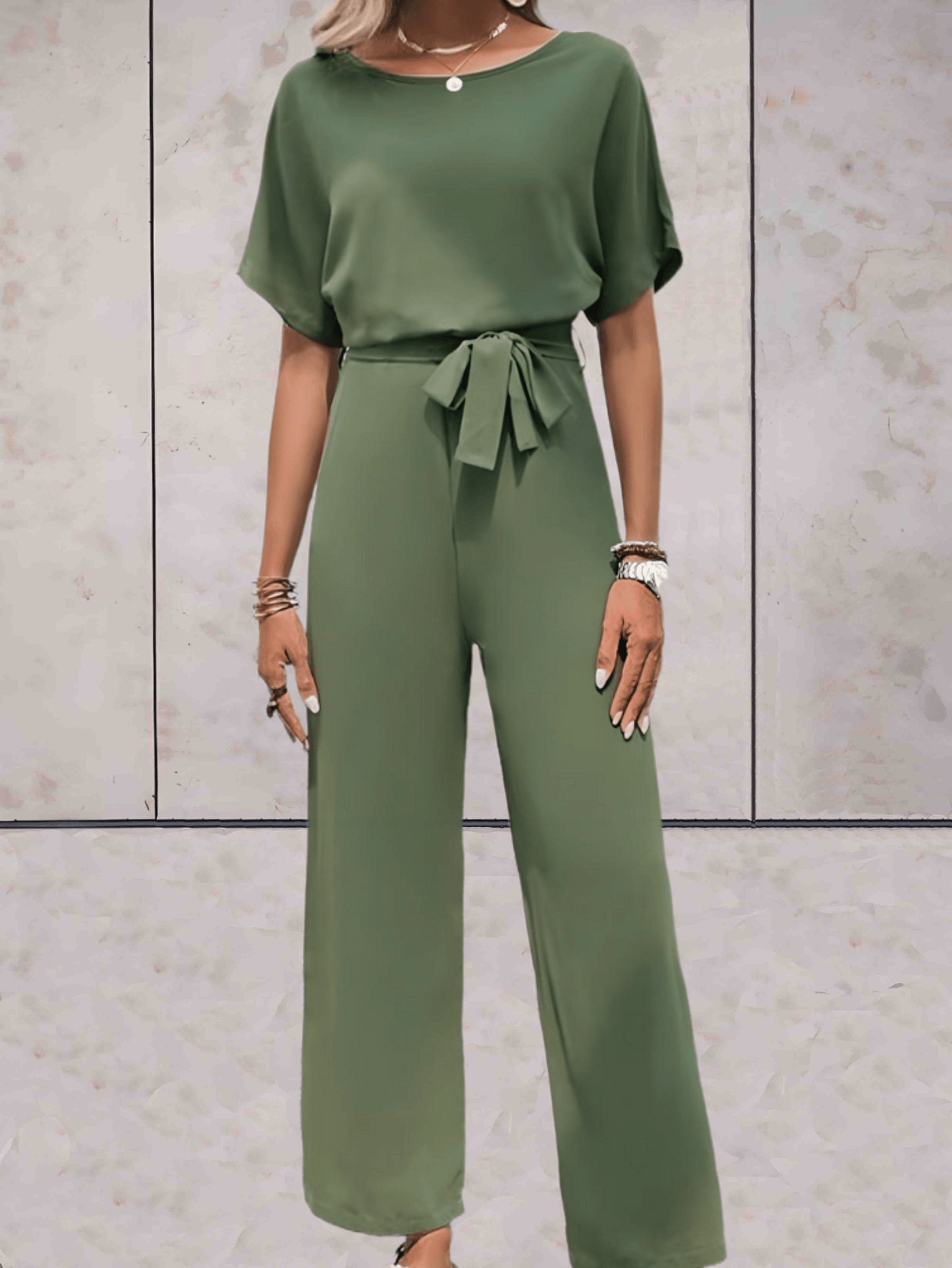 "Noa jumpsuit dames, stijlvol en comfortabel, wijde mouwen, striklinten, ademende stof, chic en veelzijdig."