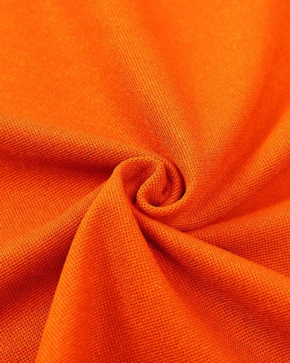 "Oranje polo shirt heren, contrasterende afwerking, slim fit, sportieve stijl voor kantoor en casual gelegenheden."
