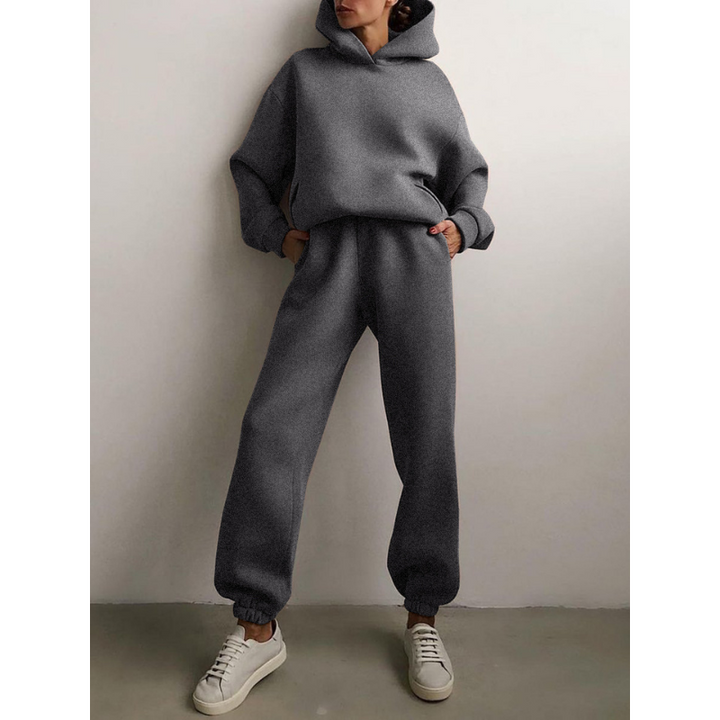 Veelzijdig dames trainingspak: oversized hoodie en hoge taille broek set, ideaal voor loungen of casual dagen.