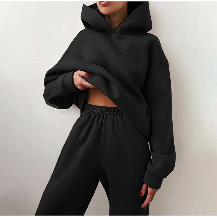 Dames oversized hoodie van het joggingpak, gecombineerd met bijpassende hoge taille broek voor een complete set.