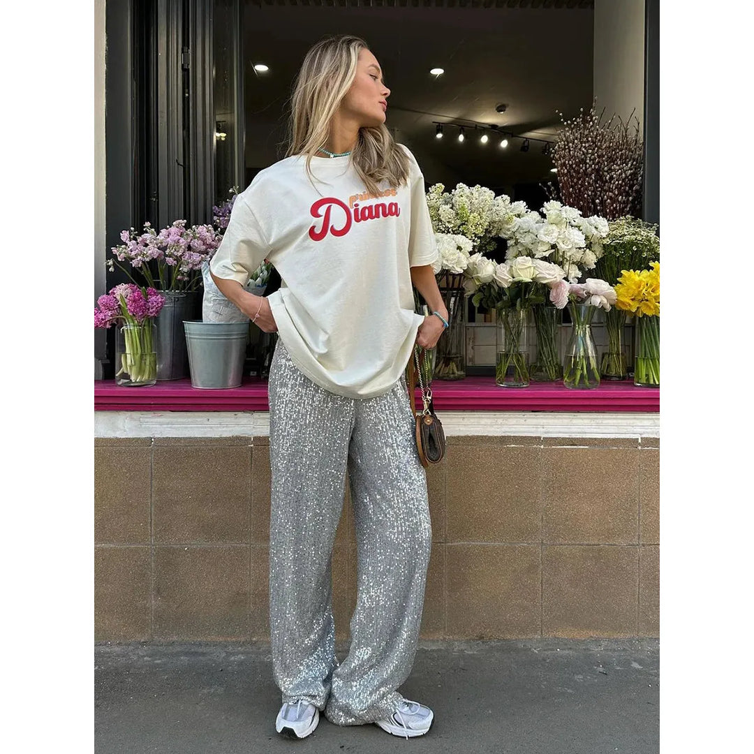 Zilveren pailletten broek Luna, zijdezacht en glamoureus. Ideaal als feestbroek voor een sprankelende look.