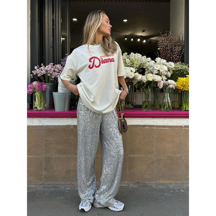 Zilveren pailletten broek Luna, zijdezacht en glamoureus. Ideaal als feestbroek voor een sprankelende look.