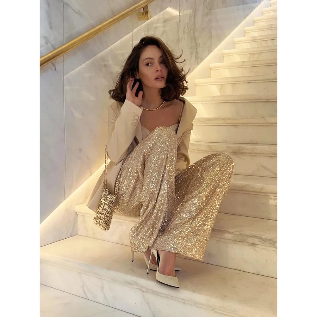 Luxe damesbroek met zijdezachte pailletten. Verkrijgbaar in goud of zilver, perfecte avondkleding.