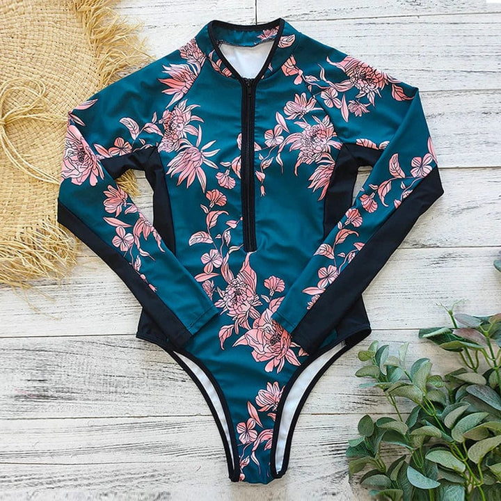 Kleurrijk dames badpak met rits en lange mouwen voor optimale UV bescherming. Geschikt voor zwemkleding.