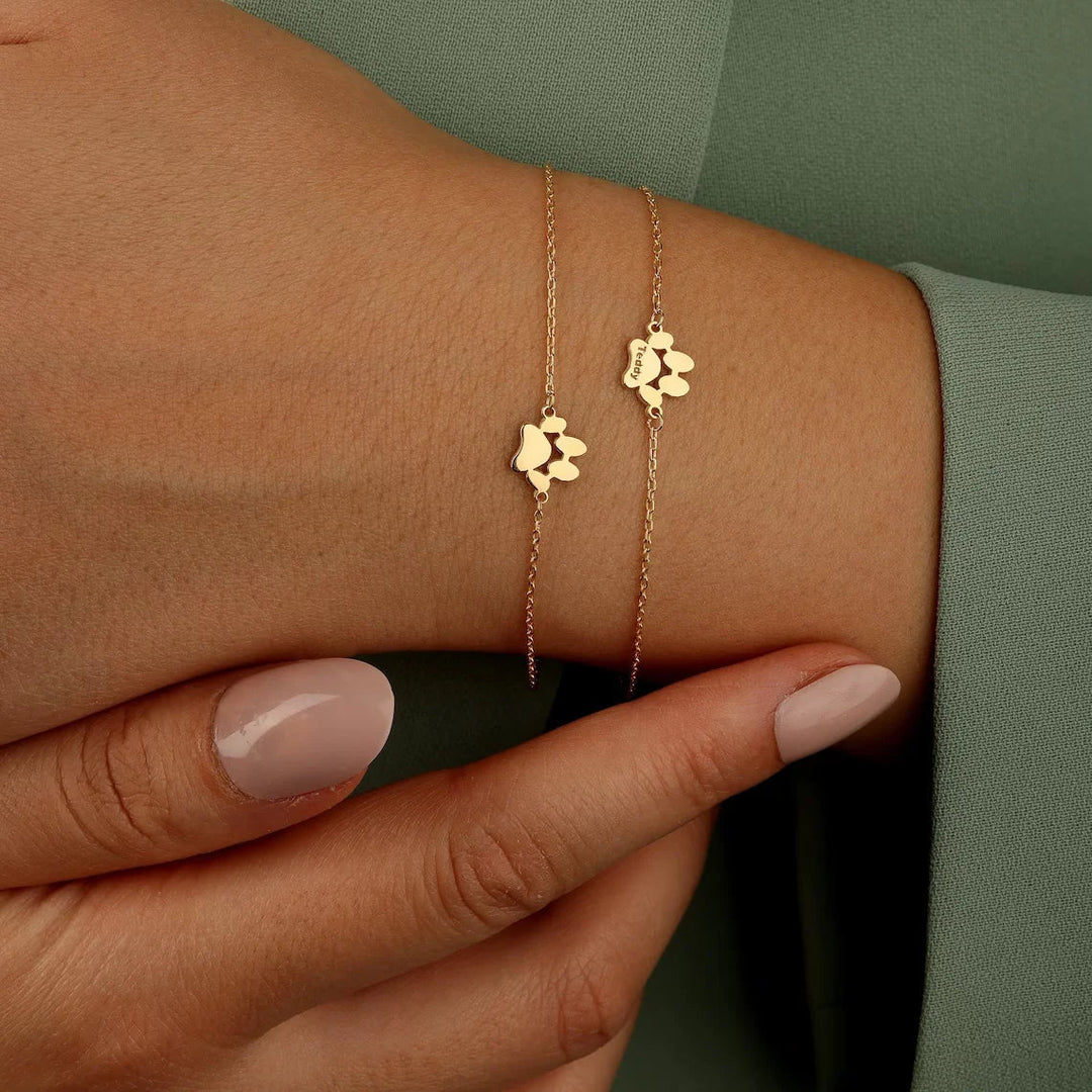 Gouden RVS dames armband voor dierenliefhebbers met gedetailleerde pootafdruk bedel, uniek sieraad cadeau.