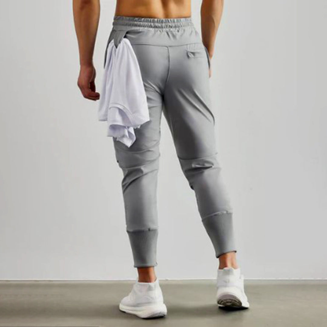 Grijze heren joggers, lichtgewicht stretchstof, ideaal voor fitness en ontspanning.