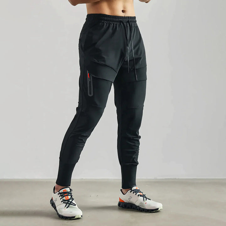 Grijze heren sportjoggers, vochtafvoerend en flexibel, optimaal voor de gym of buiten.