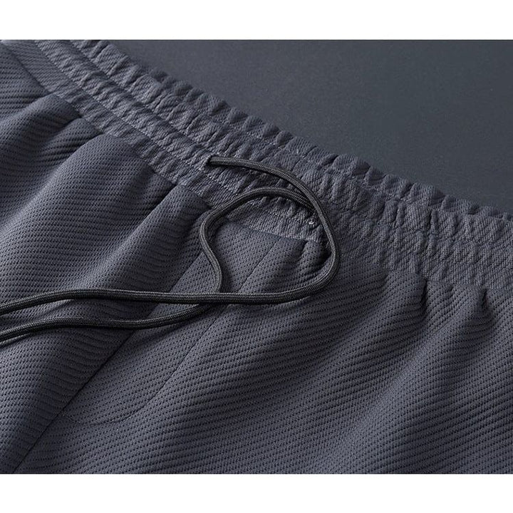 Stijlvol Lucas heren trainingspak, een premium sport outfit in zwart en blauw voor elke gelegenheid.