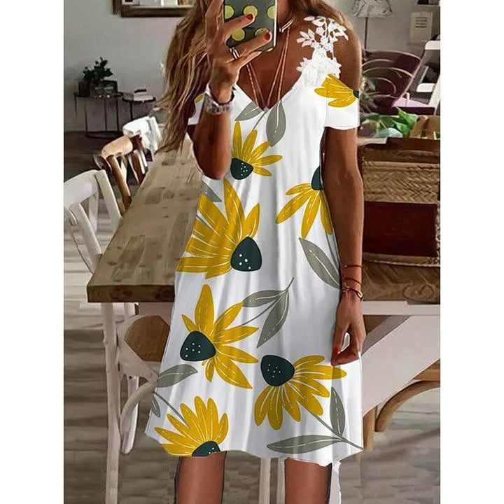 Elegante dames zomerjurk met levendig bloemdessin. Ideaal voor stijlvolle en comfortabele dagen.