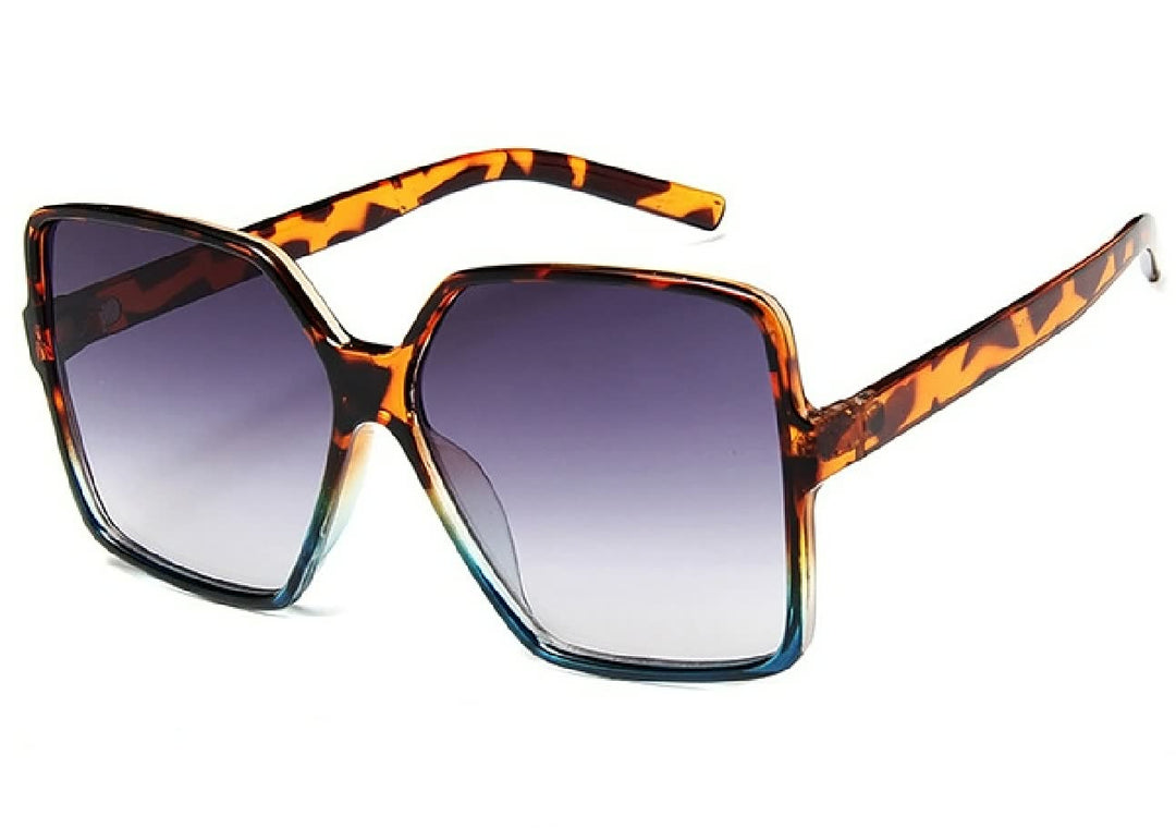 Trendy InStyle™ dames zonnebril met oversized montuur en gekleurde glazen voor zomerse stijl en UV-bescherming.