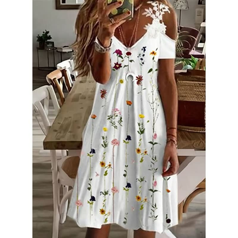 Vrouwelijke mode: stijlvolle zomerjurk met bloemenprint, perfect voor warme dagen.