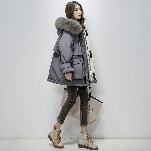 Modieuze zwarte dames winterjas, elegante thermojas met ultiem comfort. Luxe en warm.