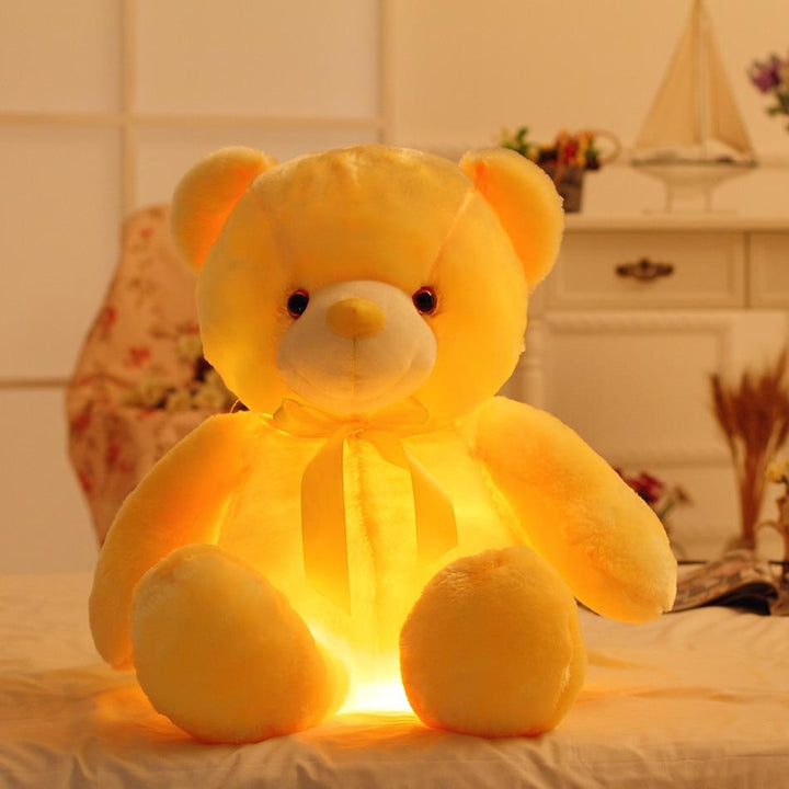 Kleurrijke LED knuffelbeer, zacht en gloeiend, als gezellig nachtlampje of vrolijke decoratie in de kinderkamer.