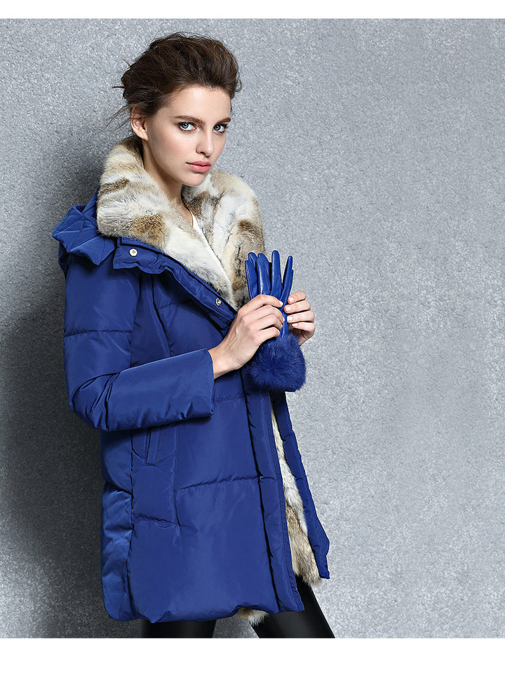 Beschermende dames winterjas met capuchon, houdt je warm en droog.