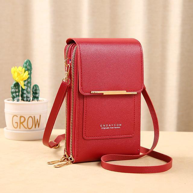 Compacte dames crossbody tas van leer. Ideaal voor telefoons, portemonnee en essentiële spullen.