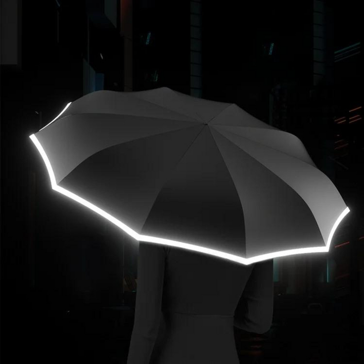 Opgevouwen compacte paraplu met reflectie, perfect voor onderweg en makkelijk mee te nemen.