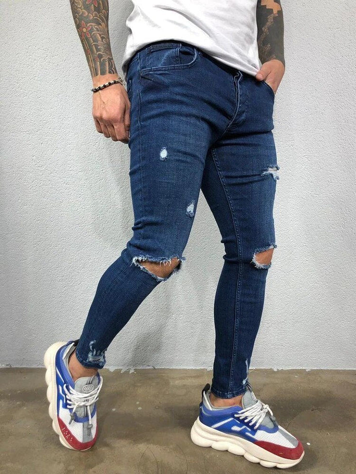 Stijlvolle heren gescheurde skinny jeans, een comfortabele herenbroek met trendy urban uitstraling.