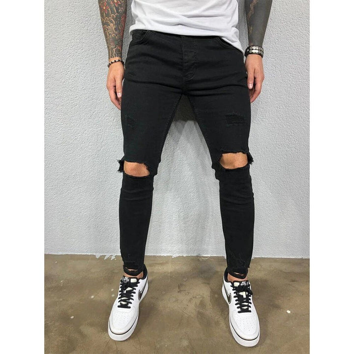 Trendy heren gescheurde skinny jeans met urban stijl, ideaal voor vrije tijd en een moderne look.