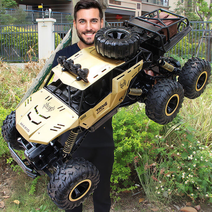 Snelle afstandsbestuurbare 6-wiel RC monstertruck in actie. Perfecte off-road terreinwagen voor avontuurlijk speelgoed.