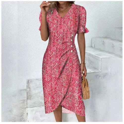 Romantische bloemen wikkeljurk met V-hals, pofmouwen en kleurrijke print, ideaal voor stijlvolle zomeroutfits.