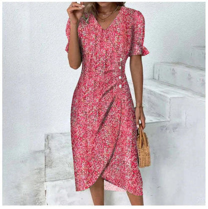 Romantische bloemen wikkeljurk met V-hals, pofmouwen en kleurrijke print, ideaal voor stijlvolle zomeroutfits.