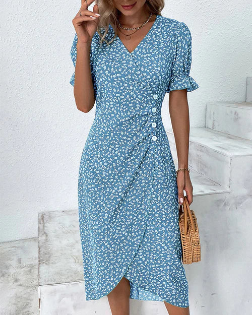 Romantische bloemen wikkeljurk met V-hals, pofmouwen en kleurrijke print, ideaal voor stijlvolle zomeroutfits.