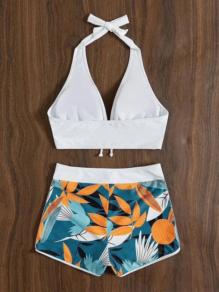 Vrolijk bloemenprint halterbikini voor dames, perfect voor een dagje zwemmen of zonnen in de zomer.