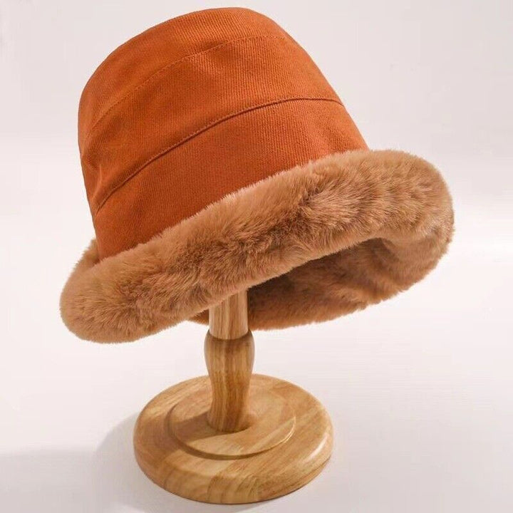 Dames wintermuts: pluche vissershoedje, warm en zacht, voor een elegante winterlook.