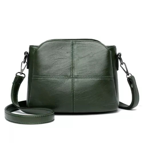 Rode PU leren compacte dames tas met verstelbare schouderriem; ideaal als elegante crossbody tas.