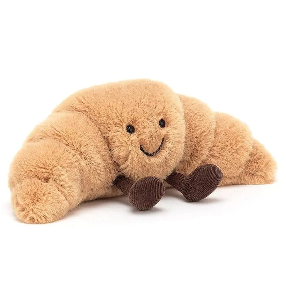 Vrolijke lachende croissant knuffel met geborduurde details, zacht pluche kussen voor comfort en speelplezier.