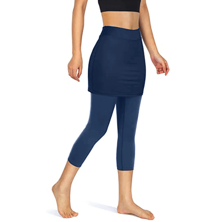 Zwarte roklegging voor dames met zijzakken, comfortabel voor yoga, fitness en vrije tijd.