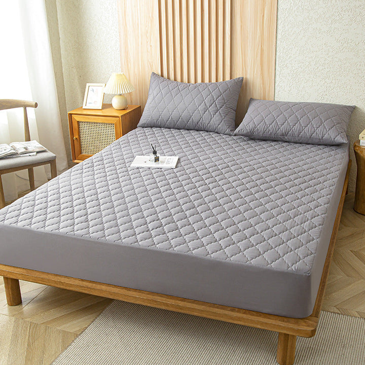 Luxe gewatteerde waterdichte matrasbeschermer, essentieel voor schone en comfortabele slaapkamer.