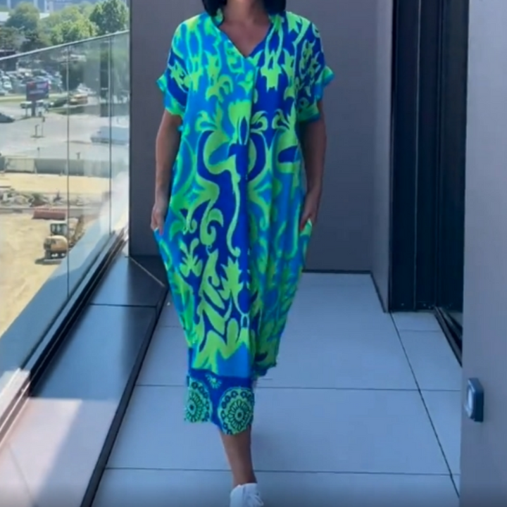 Dames kaftan midi jurk met stijlvolle print, perfect als luchtige zomerjurk of strandjurk voor vakantie.