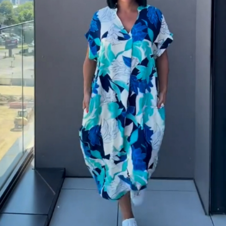 Luchtige dames kaftan zomerjurk in groen, blauw en geel, met elegante print en losse pasvorm.