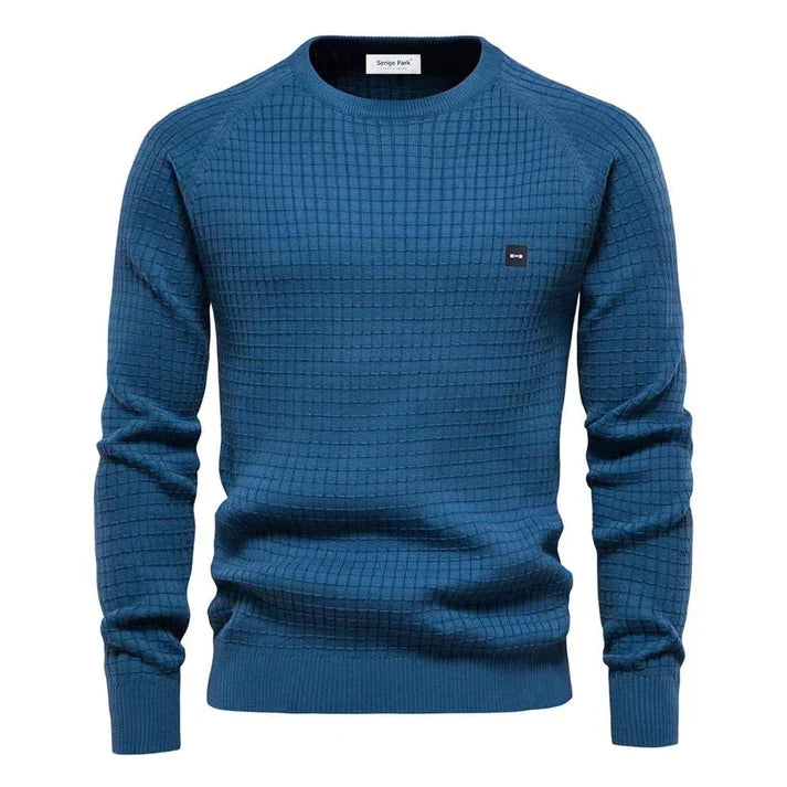 Dichtbij beeld van de comfortabele, warme gebreide textuur van de trendy heren pullover.